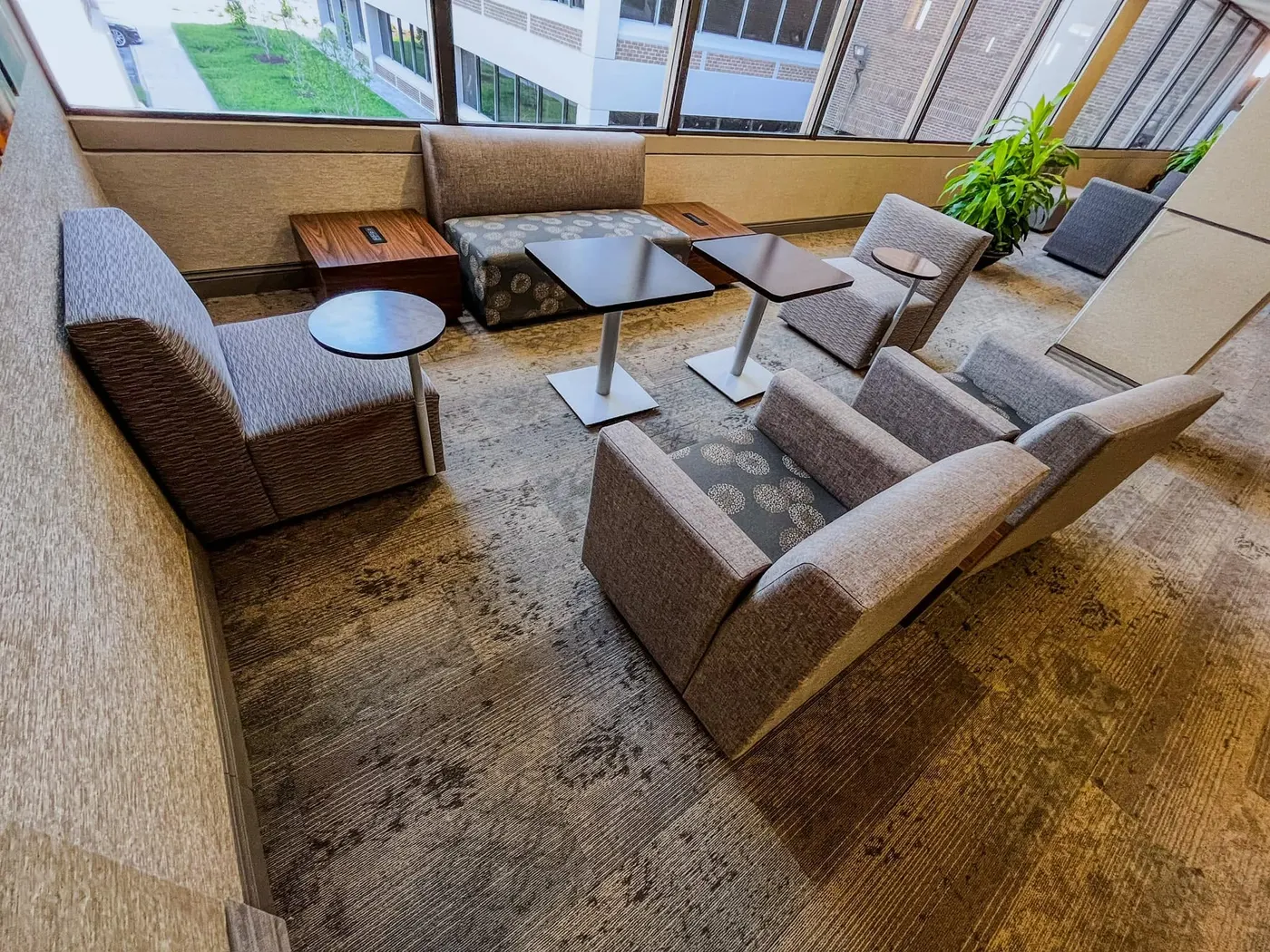 Common-area lounge with durable patterned commercial carpet
