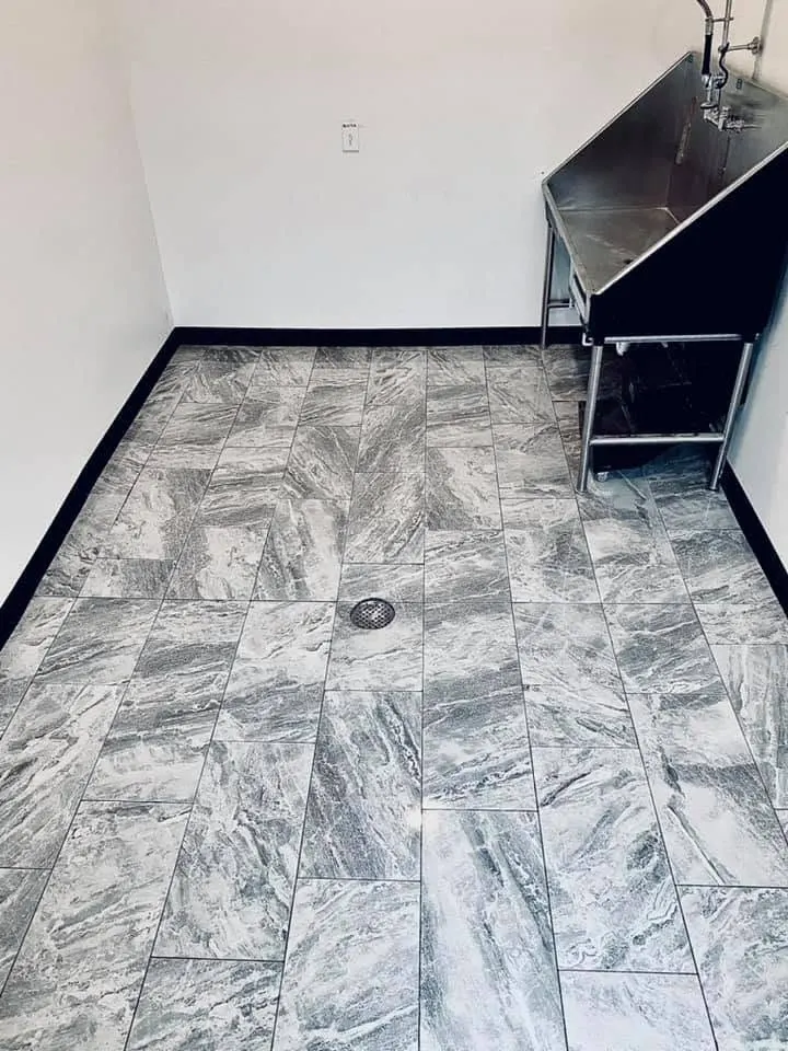 Gray marble-look tile floor installation