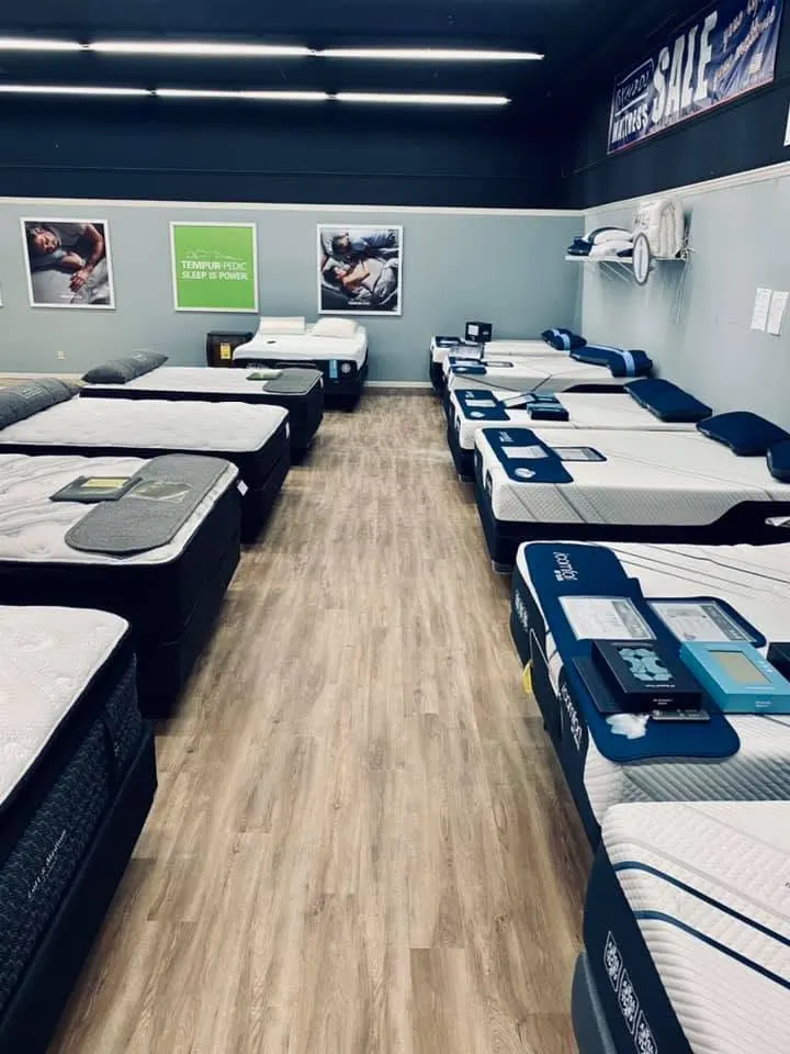 Retail mattress showroom with wood-look luxury vinyl plank flooring
