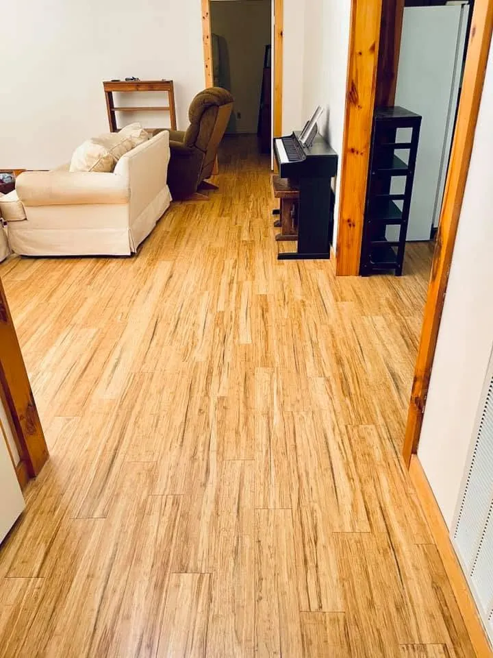 Living room with warm-tone wood-look luxury vinyl plank